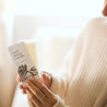 Cardamom Vanilla Soy Wax Melt being held be woman's hands. 