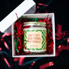 'Don't Get Your Tinsel in a Tangle' 9oz Soy Candle in a gift box with red and green tinsel. 