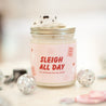 'Sleigh All Day' 9oz Soy Candle next to mini disco balls and cowboy hats. 