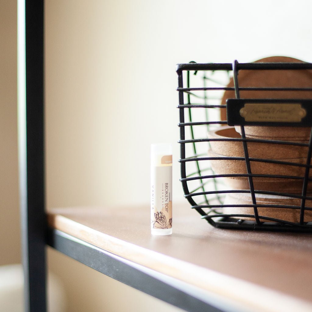 Vanilla Lip Balm on bathroom shelf. 