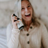 4oz White Birch Linen Spray being sprayed by a woman. 