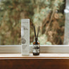 Mount Bachelor Reed Diffuser on a window sill next to the box.